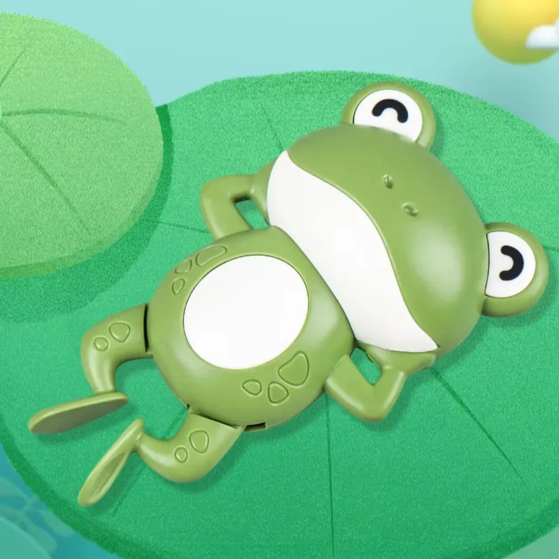 Jouet pour bébé grenouille mécanique verte.