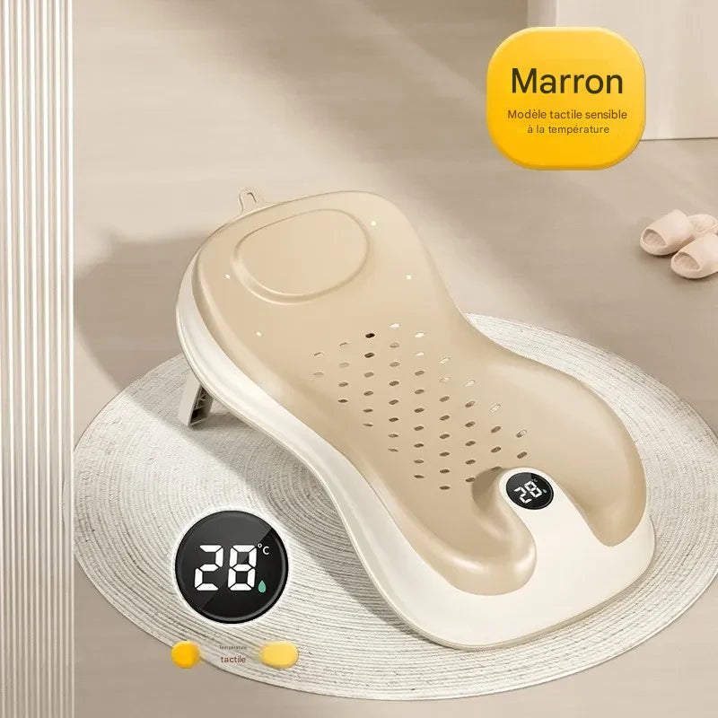 Transat de bain bébé marron avec thermomètre intégré pour contrôler la température de l’eau
