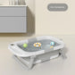 Baignoire bébé pliable gris interstellaire remplie d'eau dans salle de bain
