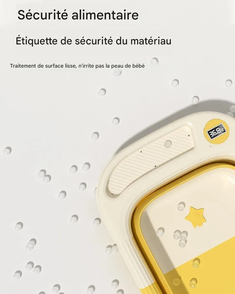 Détail bord baignoire bébé pliable jaune avec thermomètre et surface lisse sans BPA