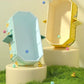 Grande baignoire bébé pliable en version jaune et bleue, design ludique avec motifs 
