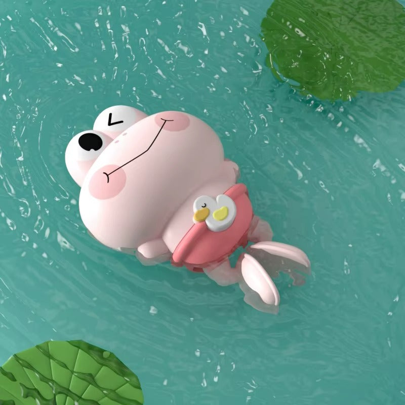 Jouet pour bain de bébé, couleur rose et forme de grenouille.