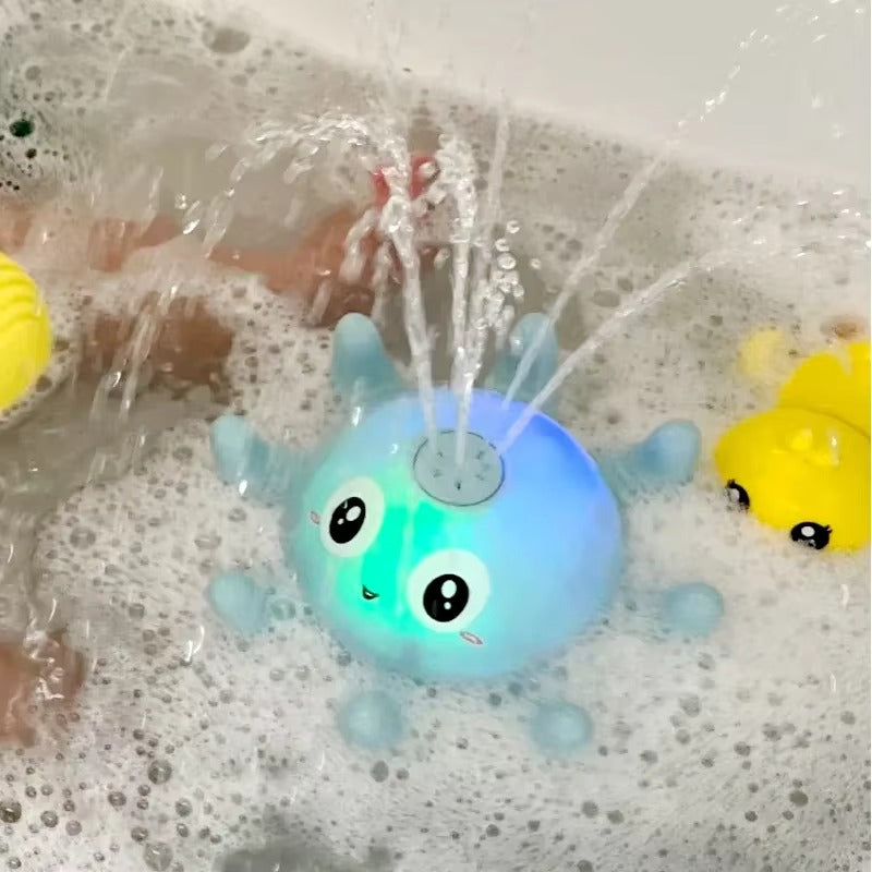 Jouet de bain pour bébé en forme de pieuvre lumineuse.
