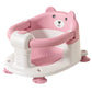 Siège baignoire enveloppant pour bébé avec protection 360° en variante rose.