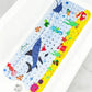 Tapis de bain pour bébé à motifs marins roquin, à poser au fond de la baignoire.