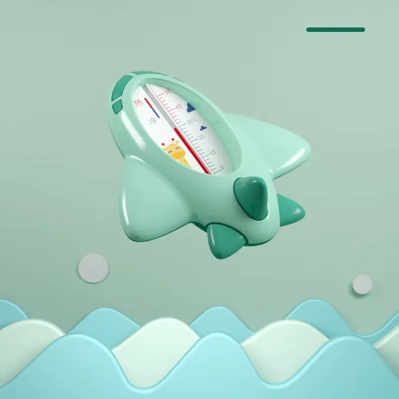 Thermomètre de bain bébé avion vert flottant, lecture stable de la température de l’eau du bain.