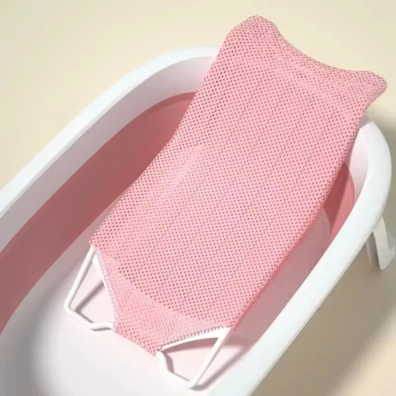 Transat de baignoire bébé en filet avec support rigide coloris rose