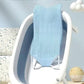 Transat-baignoire pour bébé avec filet et support rigide en vue d'angle.