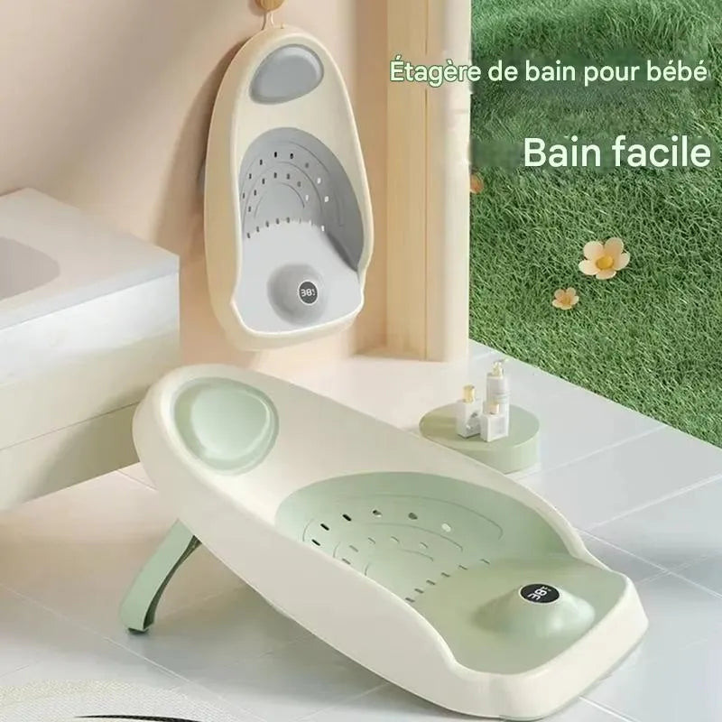 Transat-baignoire pour bébé, thermomètre de couleur vert et gris à accrocher au mur.