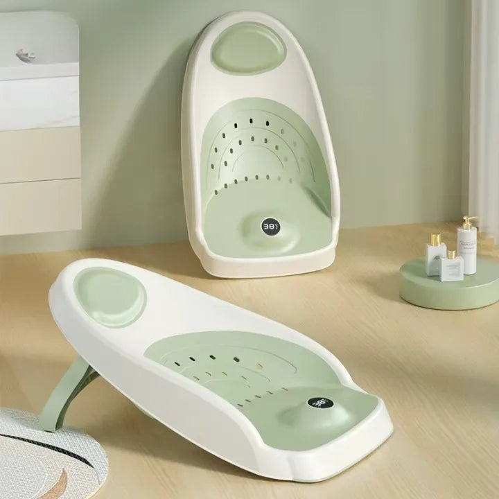 Transat-baignoire pour bébé de couleur verte.
