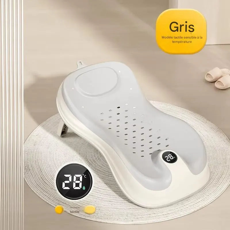Transat de bain bébé gris avec thermomètre intégré pour contrôler la température de l’eau