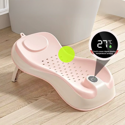 Transat de bain bébé rose avec thermomètre intégré affichant la température de l’eau